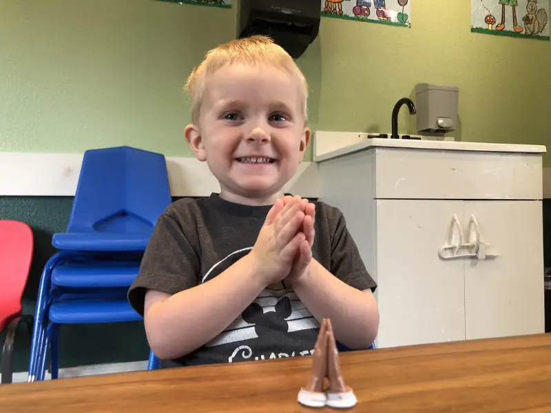 Toddler with prayer hands