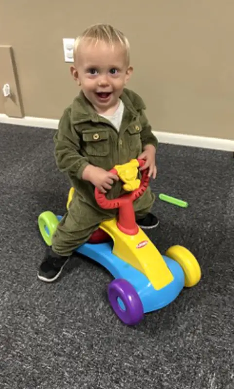 Wobbler riding a car toy