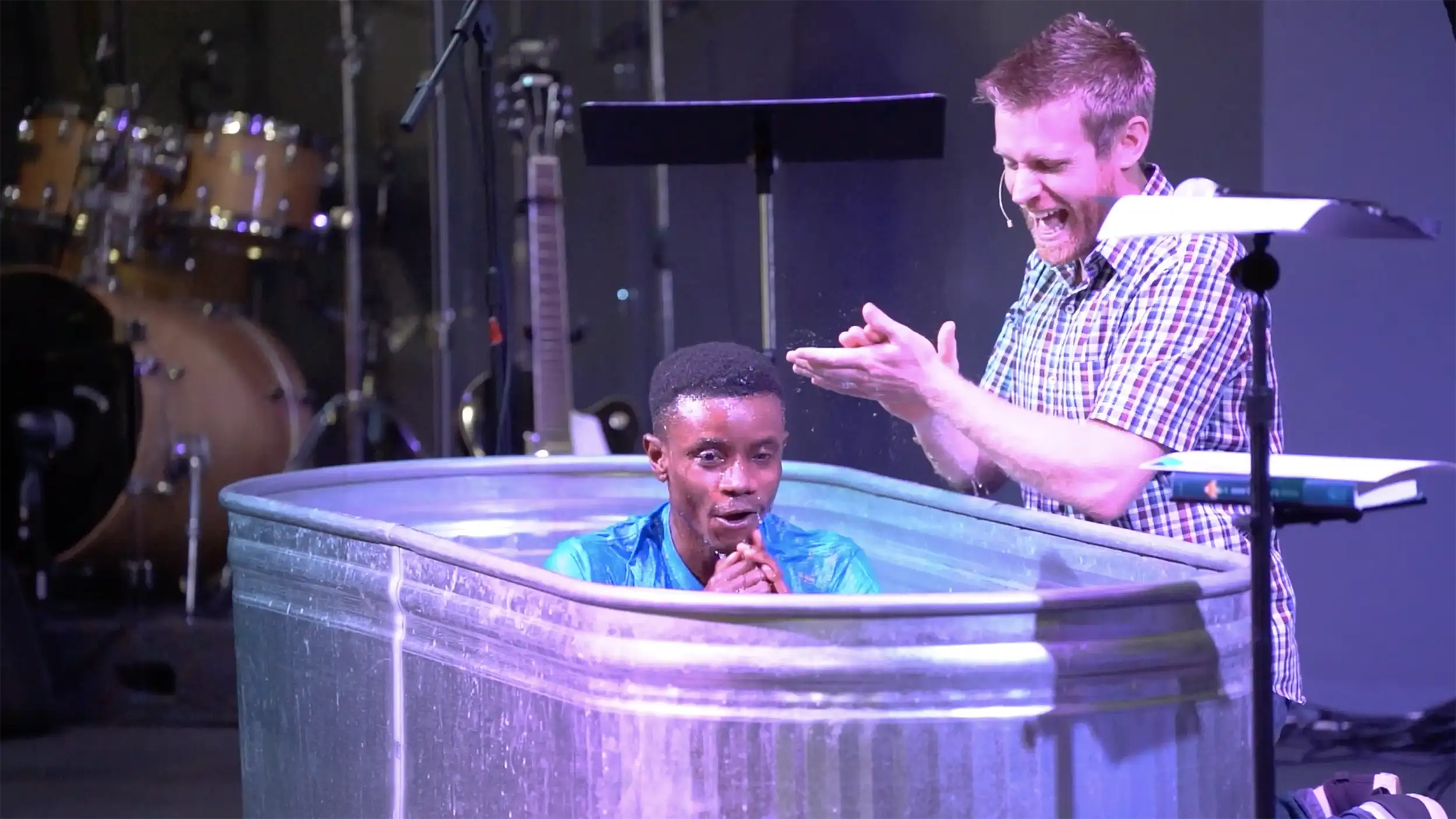 Pastor David baptising a new believer